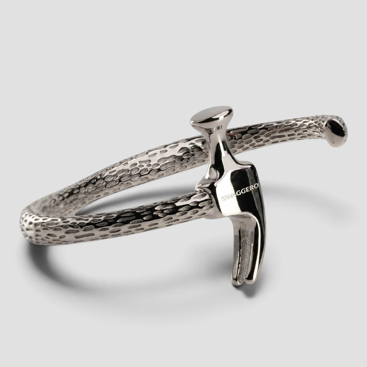 SWAGGERO Silver Talon hammered steel cuff bracelet with talon clasp, studio product photo